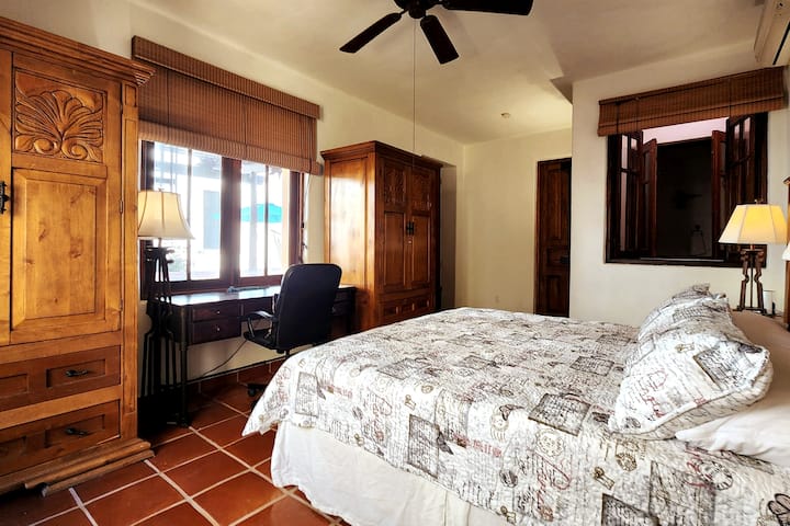 There is also a ceiling fan, its own AC  unit for comfort, and window looking down to the hallway of the ground floor.