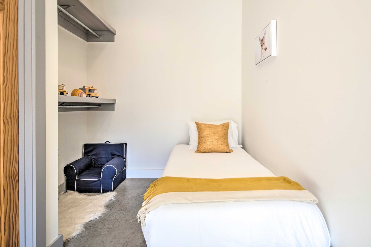 Cozy kids room with 2 twin beds and reading/ play nook. Perfect for little ones but ample space for adult-size children.