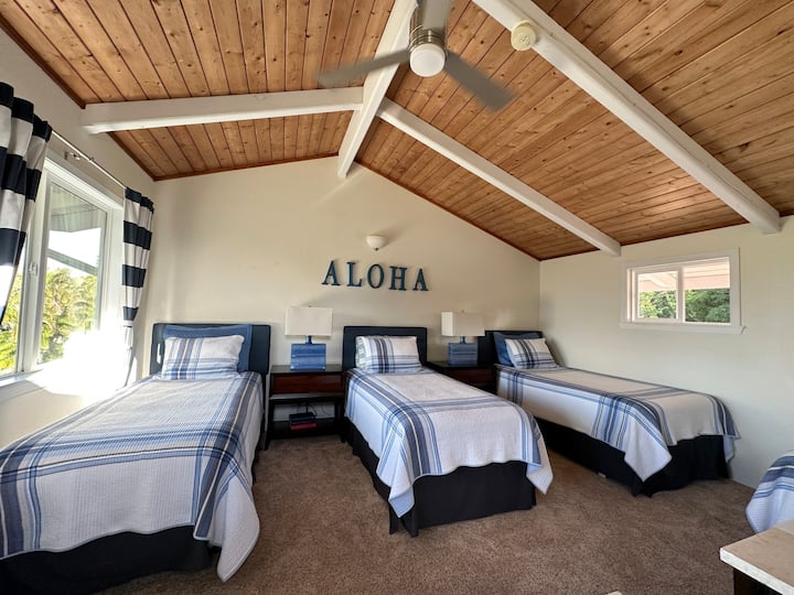 Upstairs bedroom as four twin beds...