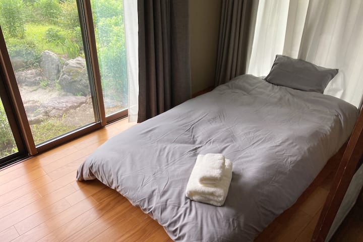 Single bed placed on the veranda (right side)
