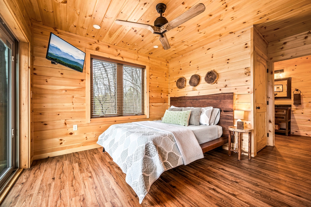 The queen bedroom (main floor) has large windows, direct access to the shared main floor bathroom, and a closet with a washer, dryer, and ironing board available for you to use. A small dresser is also provided for clothing storage.