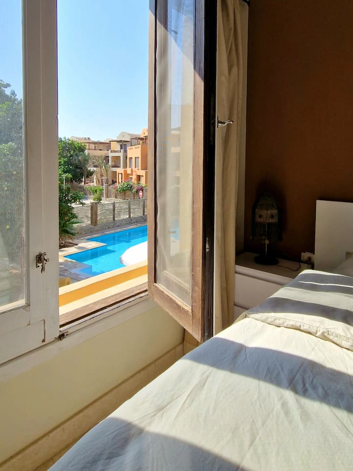 Bedroom with direct views to the pool