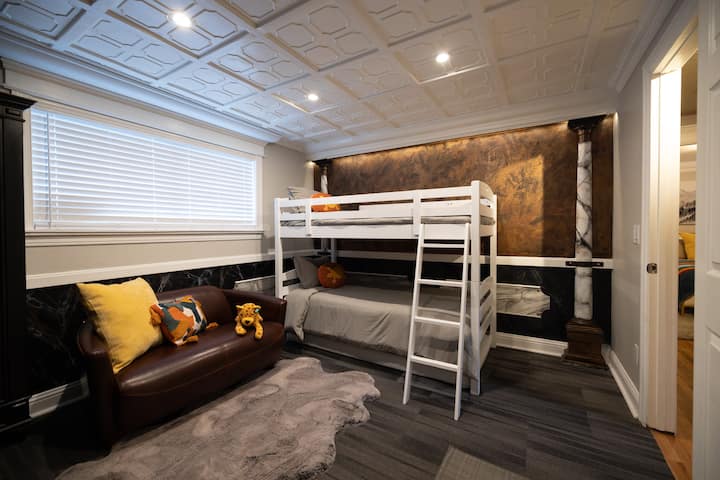 Adventure awaits in our playful kids' room, complete with cozy bunk beds and endless entertainment options. Let your little ones' imaginations run wild as they explore the room's fun games and vibrant decor.