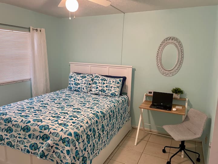 Secondary bedroom features a queen bed with pull-out twin trundle bed that can easily be tucked away when not in use for extra space.