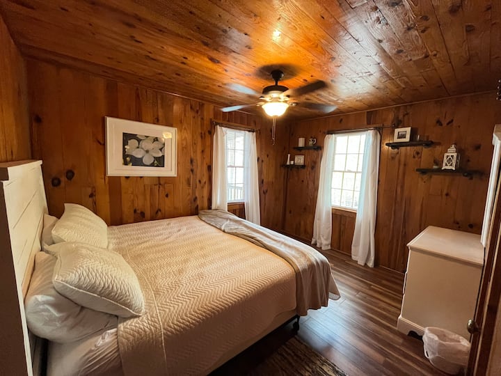 Master room with closet and king size bed.