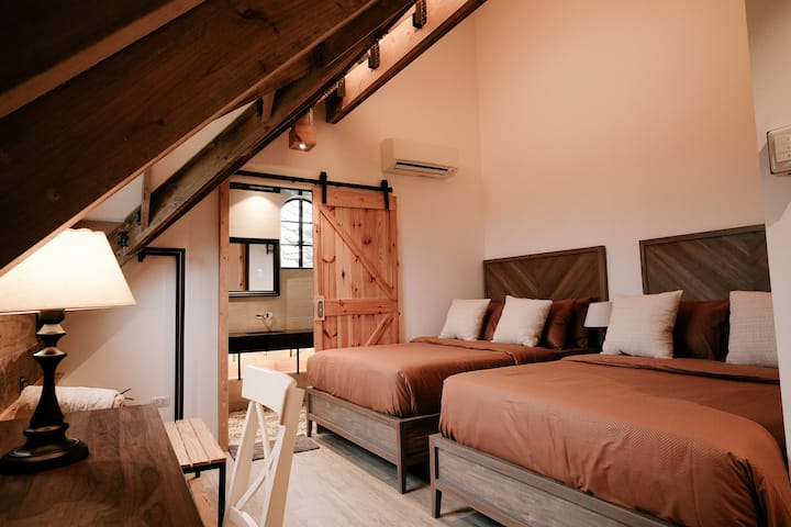 Aesthetic rustic bedroom with 2 queen sized beds