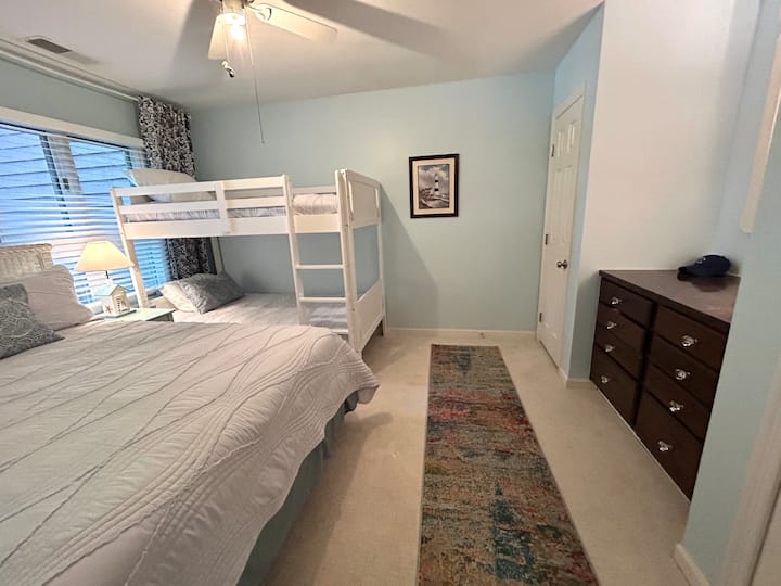 Second bedroom includes cloud soft Pottery Barn linens on a queen bed and twin bunks, closet and built-in dresser. 