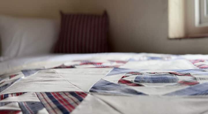 Handmade traditional patchwork quilts with fleecy lining.