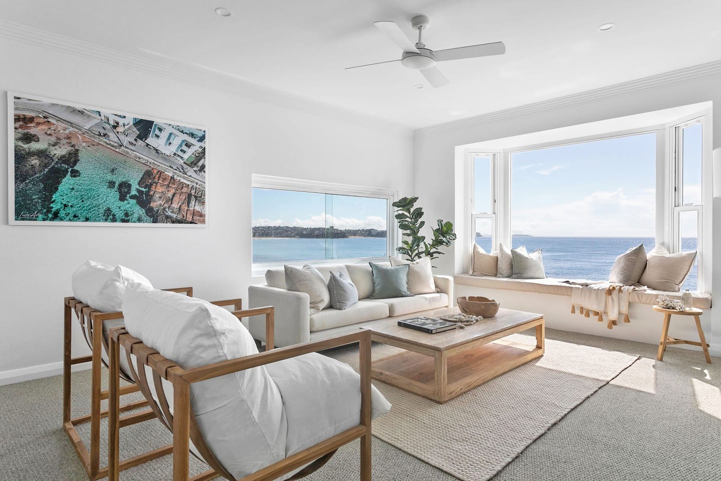 Living room with ocean view at the Luxury Manly Oceanfront Getaway.