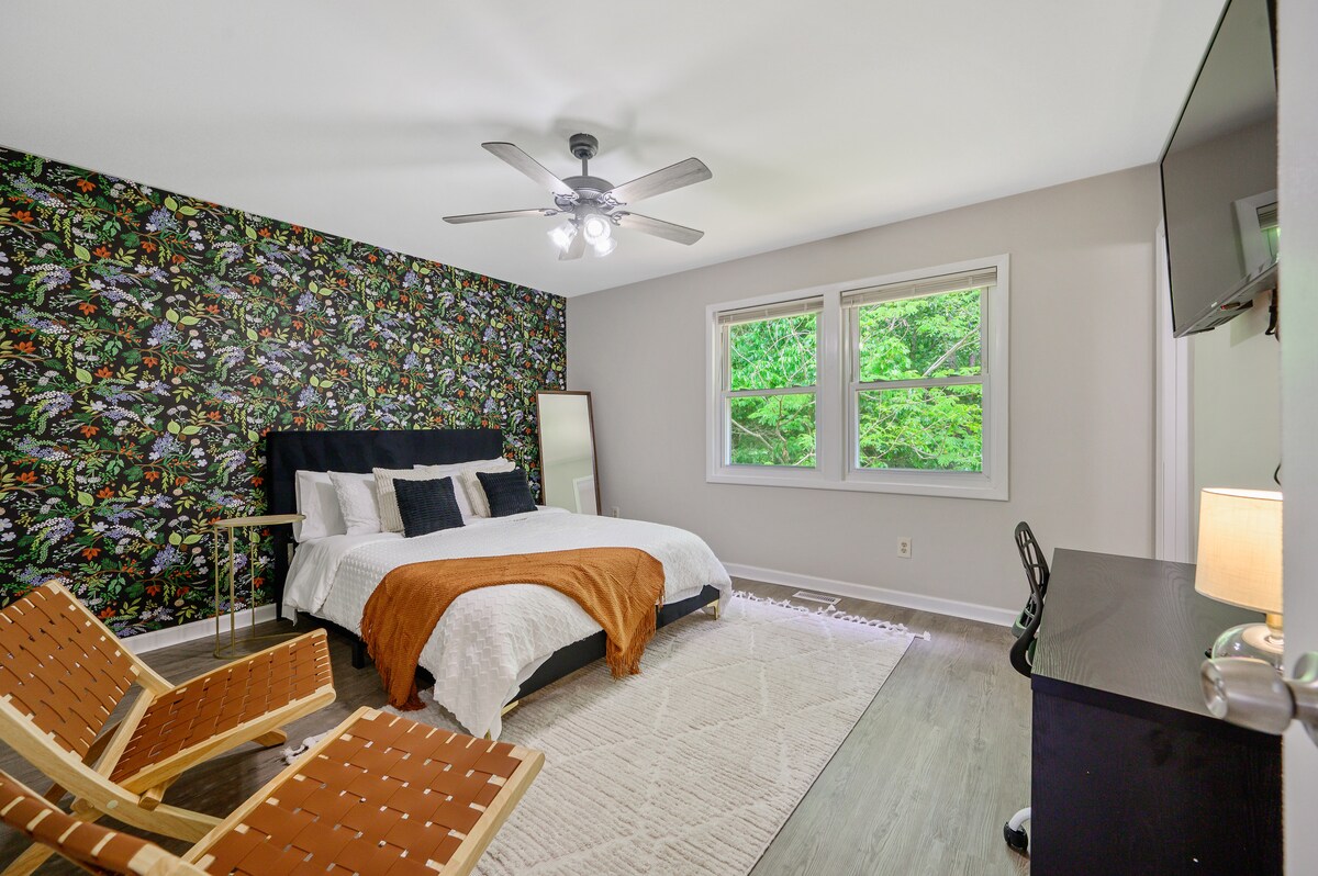 Wake up to stunning views from our breathtaking bedroom with two lounge chair