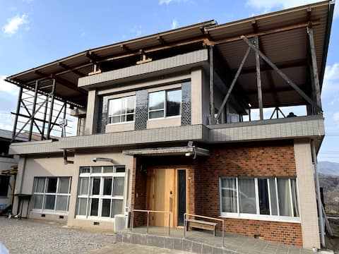 New house with no name: Quiet location next to a field. There is also a wood stove.