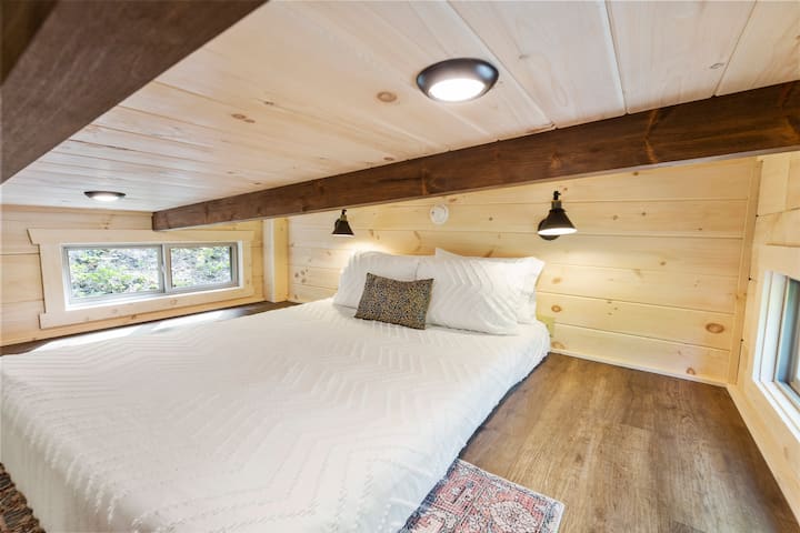 Loft with queen bed lounge area. Recommended for ages six and up. 