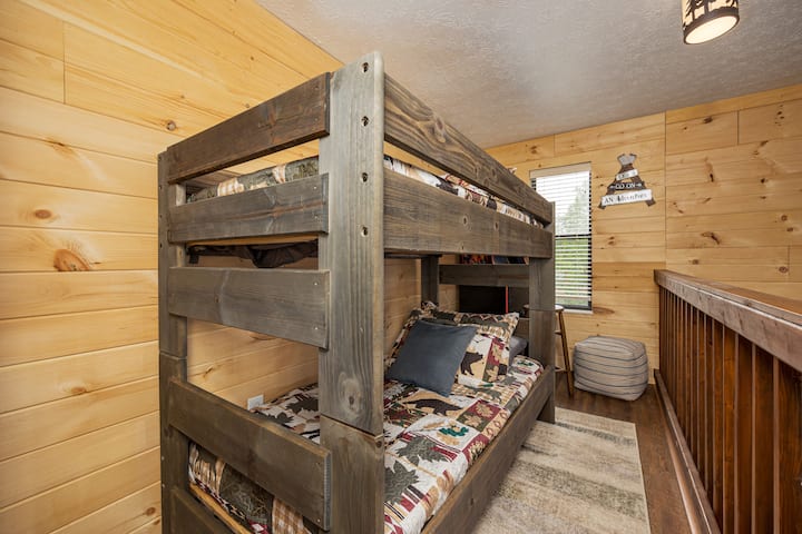 Enjoy the comfy bunkbeds in this room. This is noted as the 3rd bedroom, but it is more of a loft. However, it does have a window and closet for this space. The arcade game is here as well.