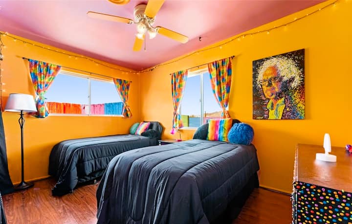 Second bedroom includes two twin beds, a dresser, and full closet.