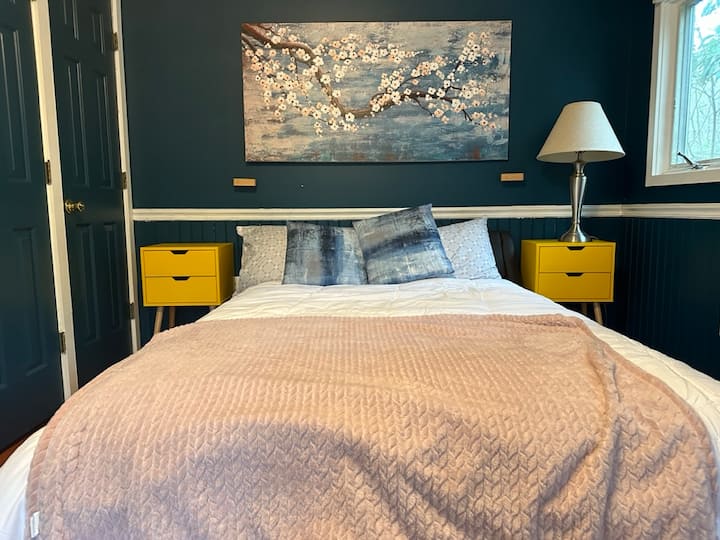 The 2nd floor bedroom has a doorway leading to the upper deck. 