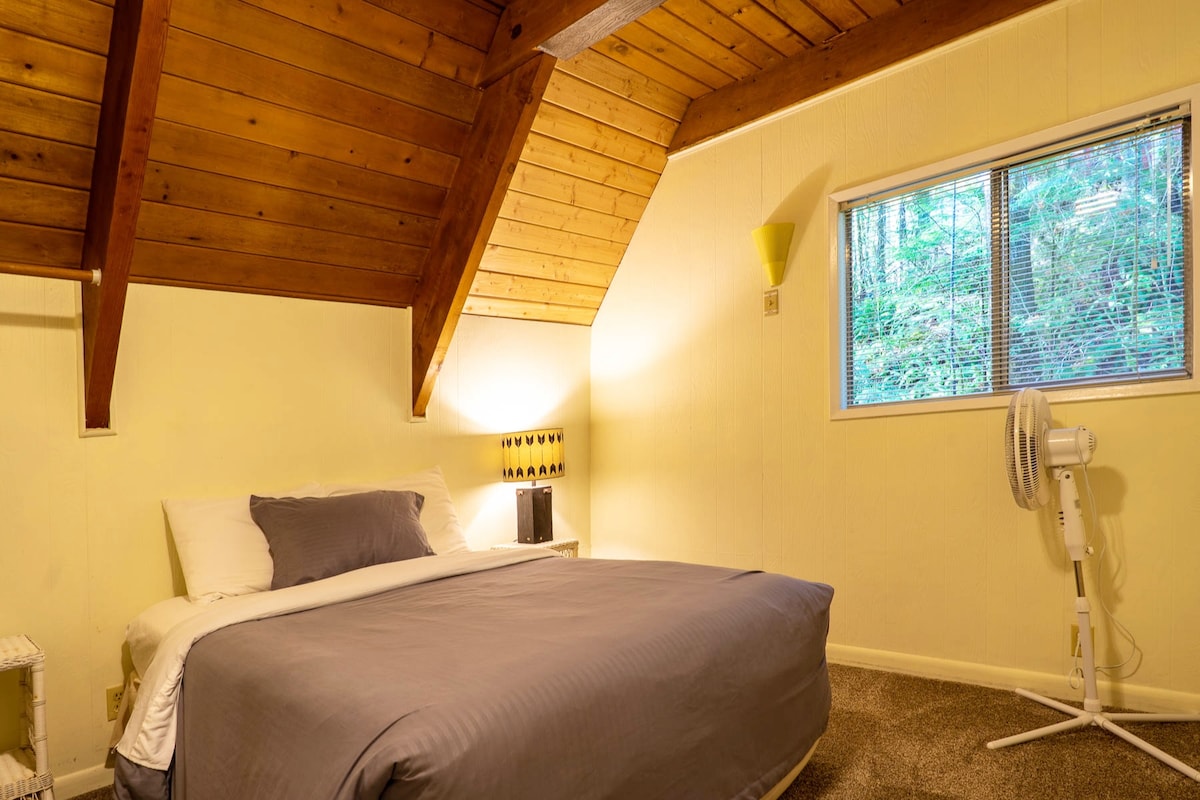 Rear bedroom (3 of 4) above the half bath and kitchen.  has a double/full bed.