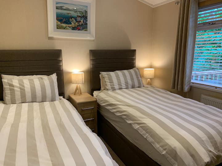 Twin room with 2 single beds, wardrobe, tv.