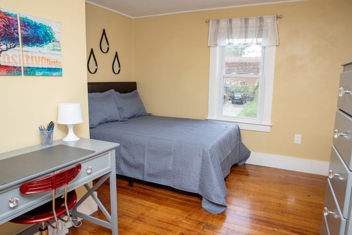 A full bed and desk make this a great workspace. 