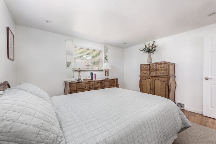 Primary bedroom with queen-sized bed + closet