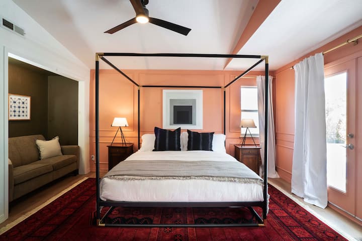 Master bedroom with seating area, coffee bar, private outdoor patio, and en suite bathroom.