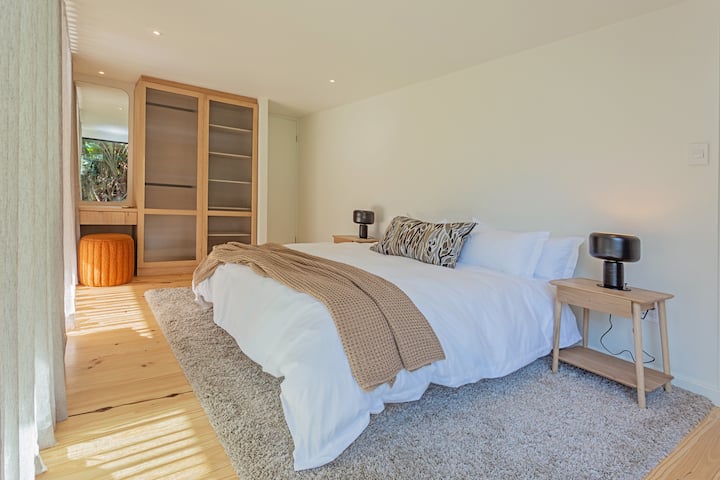 Primary Bedroom.
Equipped with luxury linen and furniture.
King size, extra length bed and build in cupboard.
