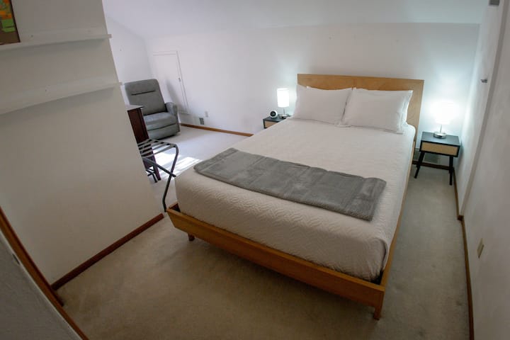 Bedroom, queen-sized bed and sitting area, second floor.
