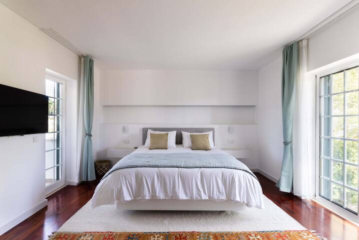 Relaxing home with pine trees, quiet garden & pool gallery image 4