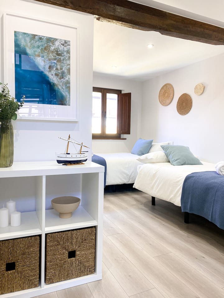 Very bright room with original wooden beams.  It has two new beds and quality bedding. It also has a large built-in double closet and modern and cozy decoration
