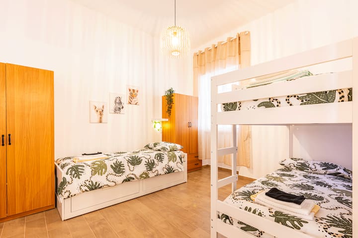 The adjacent bedroom has a pull-out bed that turns into a comfortable double bed and a bunk bed. It has the capacity to accommodate four people