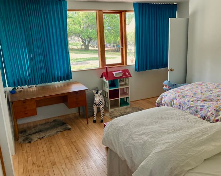2nd bedroom-- with north view and quiet work desk; this was a kids' room, but is comfortable for all. 