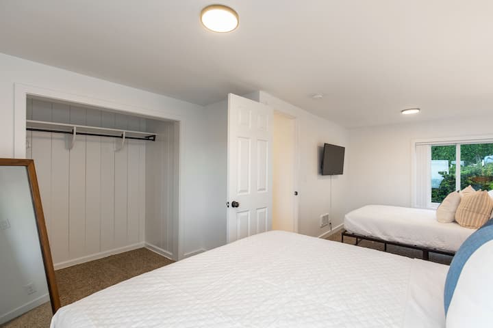 Bedroom #2 comes with two beds and is located at the west end of the home. This bedroom includes a queen and full bed, large closet and large TV. 