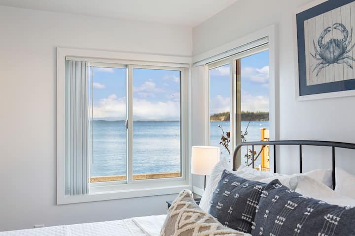 View from the primary bedroom at the east end of the home. Sleep with the windows open with nothing but the ocean waters to lull  you to sleep.