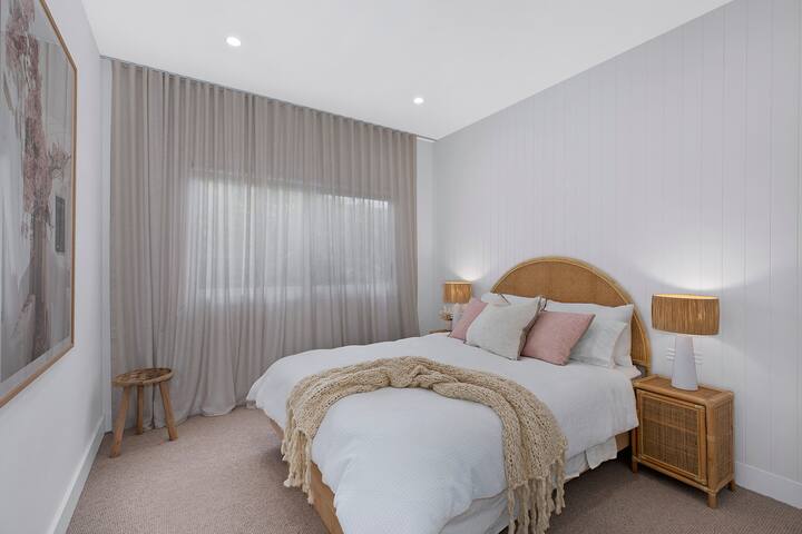 Queen Bedroom with standalone AC controls, build in wardrobe and automated blinds.