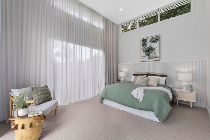 Large well appointed master bedroom with automated blinds. Opens onto rear deck area and ensuite. Space for portacot on request.