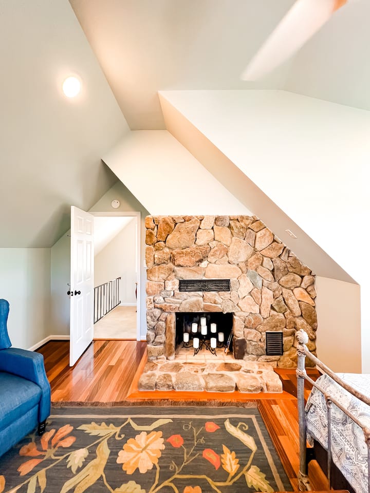 Romantic candles in the main bedroom fireplace.