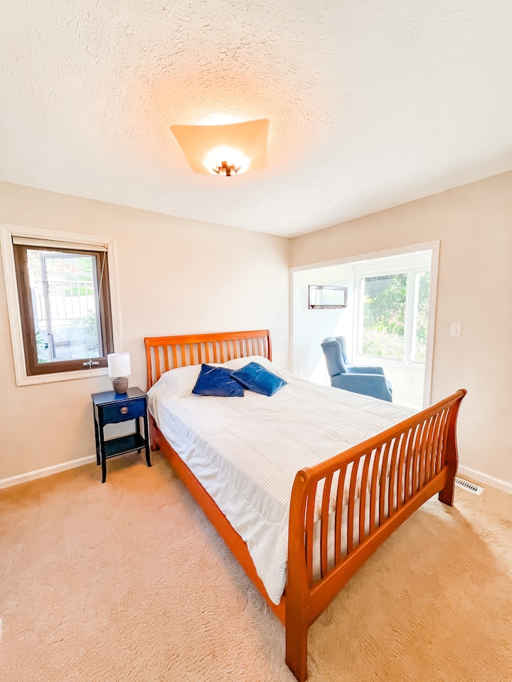 East bedroom with Queen and garden view.