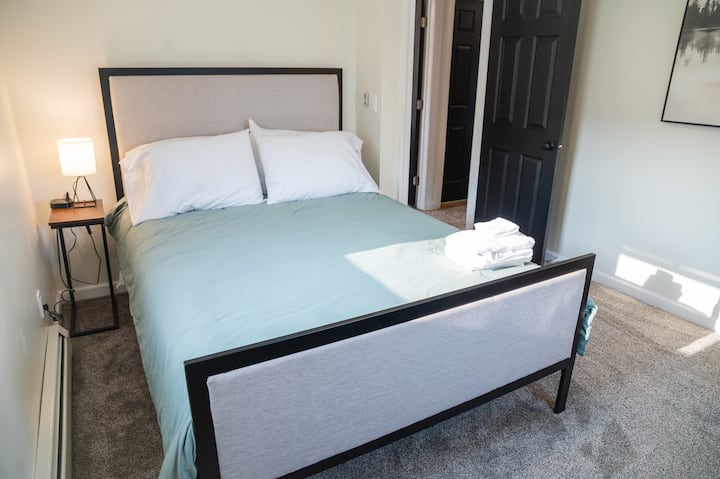 Bedroom 2 with queen bed and reading nook