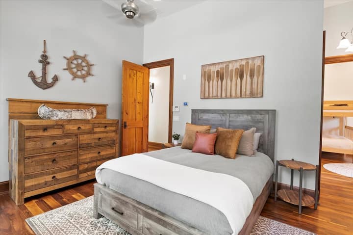 Located on the Main floor, south wing features a queen bedroom with a full bathroom and a jacuzzi tub.  Attached to this bedroom with its private entrance is another bedroom with a queen-over-queen bunk bed.
