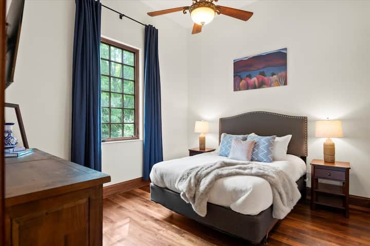 Located on the main floor’s North wing, a queen bedroom, with attached full bathroom.