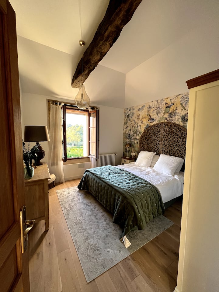 The second master suite of the main house and its view of the garden