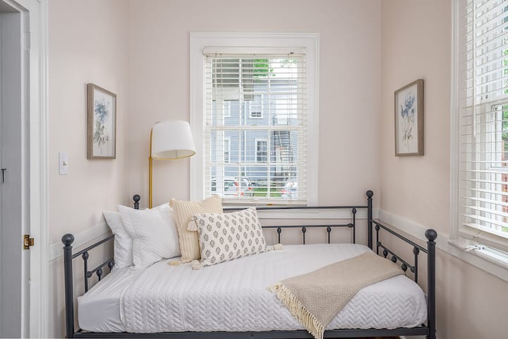 The guest bedroom has a twin size daybed with a memory foam mattress.