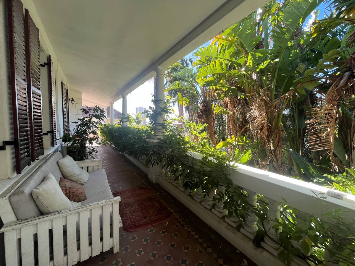 Shaded patio at the Utopia mansion, Atlantic Seaboard co-living