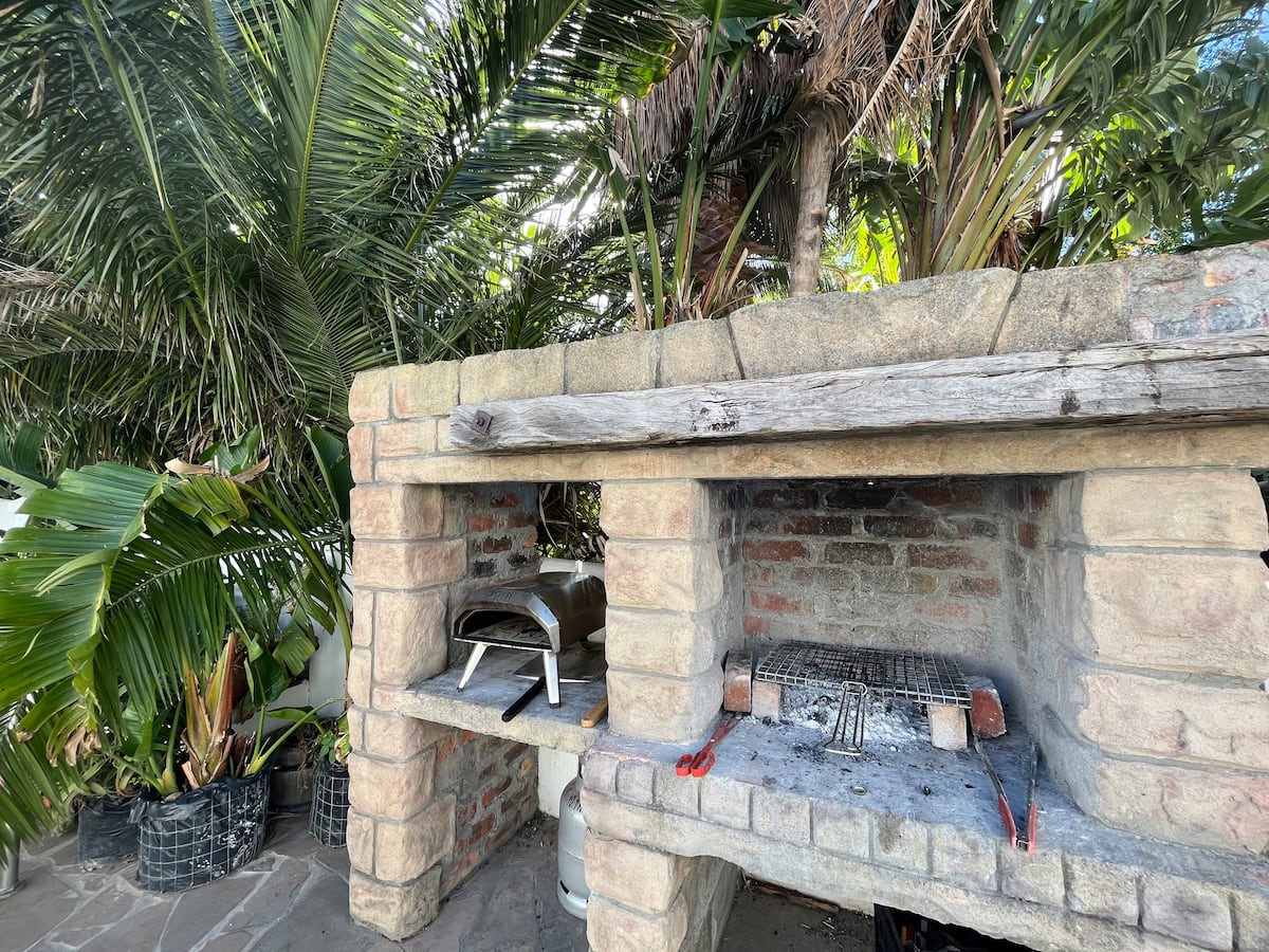 Braai area under the palms at Utopia co-living, Fresnaye