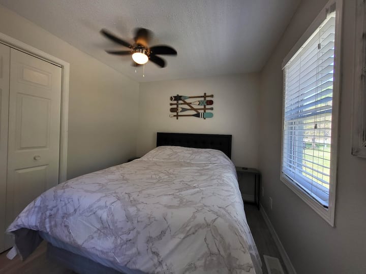 Main Bedroom with 2 nightstands and cell phone wireless charging pads.  Dresser located in closet.
