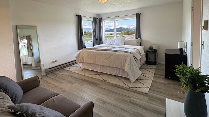 Master bedroom with a king size bed and amazing views.