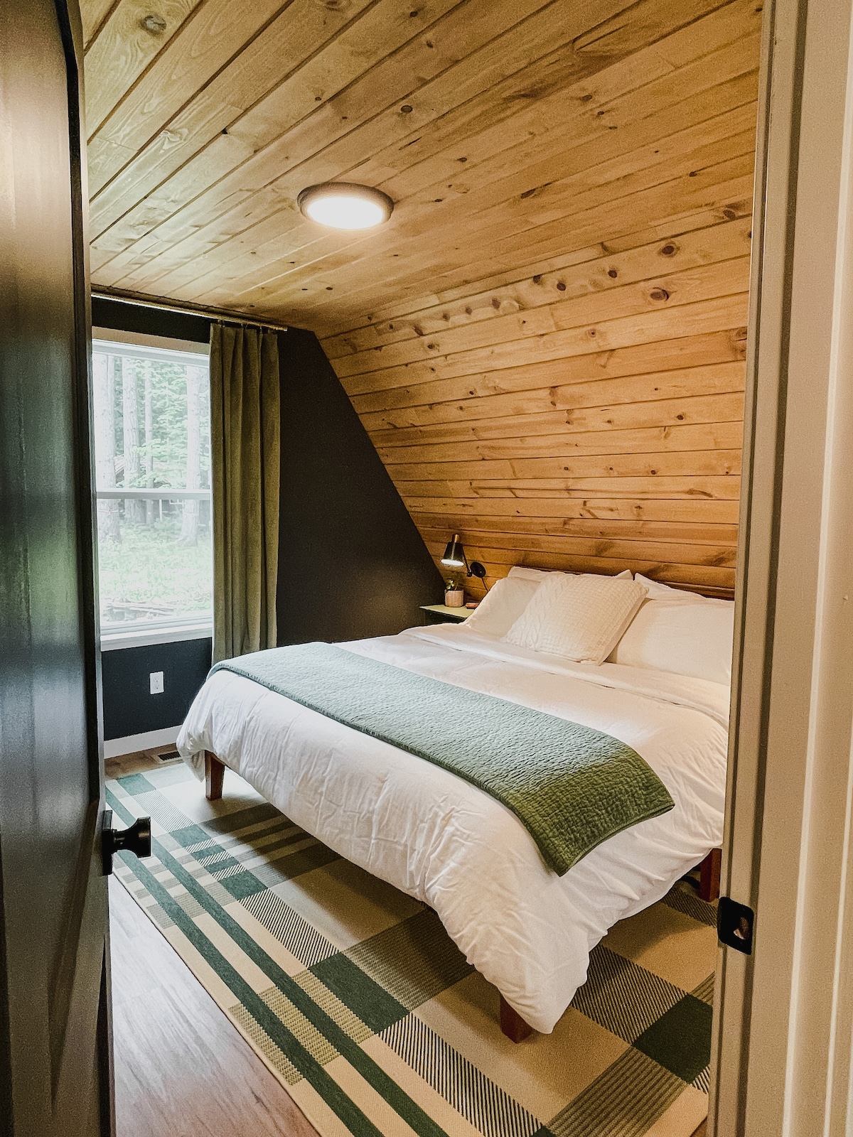 Two private king bedrooms are located on the first floor. Each room features comfortable, medium-plush mattresses and soft, cotton bedding, offering tranquil, private spaces to unwind and recharge.
