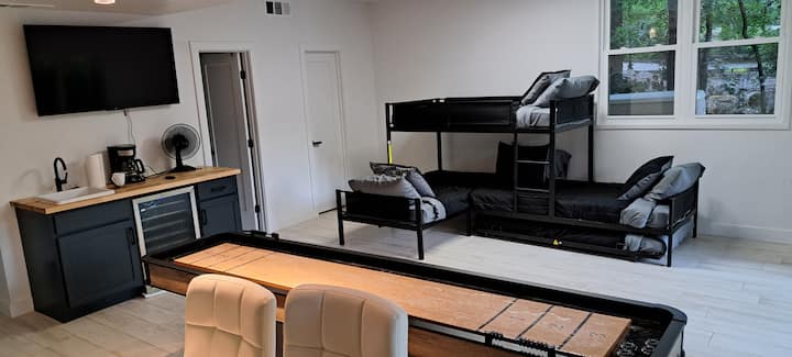 Game Room: Quadruple Bunks, Shuffleboard table, HD Television (XBox ready), downstairs Full bathroom and Washer/Dryer room. Oh, and another Wine,,, errr Drink refrigerator for the kids ;) (I suppose adult beverages could be supervised here too...)