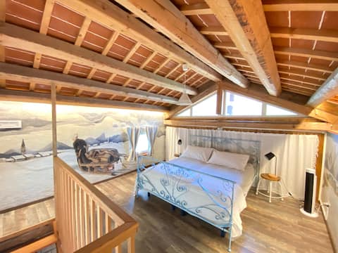 Tiny painted house in a flower farm