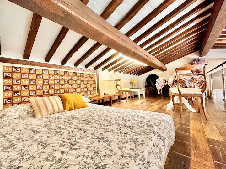 Bedroom on mezzanine, with double tatami bed and study corner with desk and ergonomic chair.
The room has no door, but overlooks the living room.