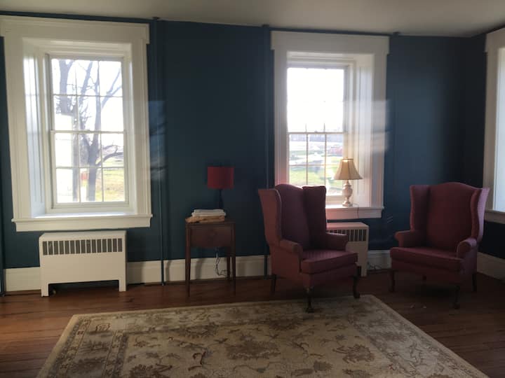 Buddy up for a conversation or to share a glass of refreshements in a classic historic MD farm house.